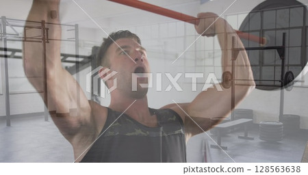 Composite of caucasian man lifting barbell weights, and gym Composite of caucasian man lifting barbell weights, and gym 128563638