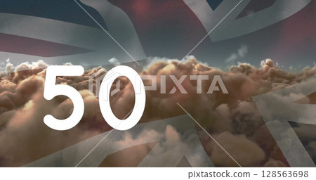Image of counter over clouds and flag of united kingdom 128563698