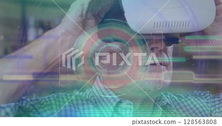 Image of scope scanning and data processing over man wearing vr headset Image of scope scanning and data processing over man wearing vr headset 128563808