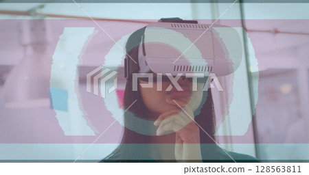 Image of scope scanning and data processing over woman wearing vr headset Image of scope scanning and data processing over woman wearing vr headset 128563811