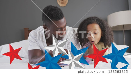 Image of red, blue and white stars over african american father and daughter having fun 128563835