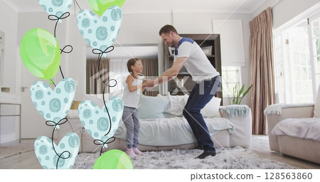 Image of balloons over happy caucasian father and daughter jumping and playing at honme Image of balloons over happy caucasian father and daughter jumping and playing at honme 128563860