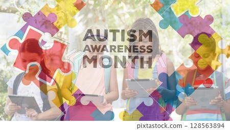 Image of colourful puzzle pieces and autism text over kids friends using electronic devices 128563894