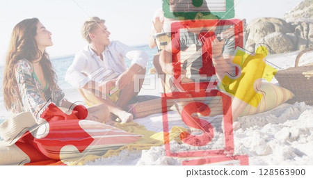 Image of colourful puzzle pieces and autism text over happy friends at summer beach party 128563900
