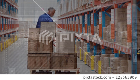 Image of data processing one man working in warehouse Image of data processing one man working in warehouse 128563909