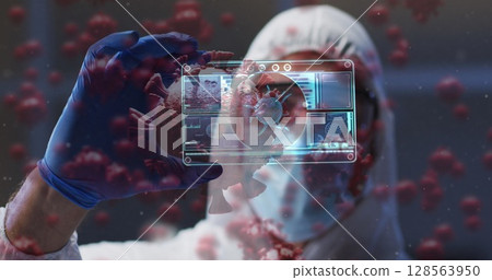 Image of virus cells and digital interface over male doctor wearing face mask 128563950