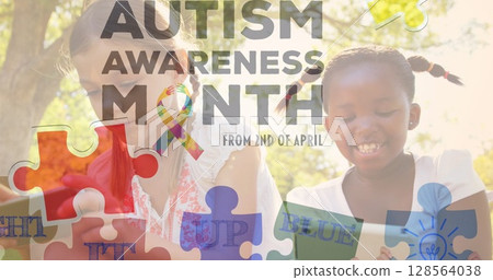 Image of colourful puzzle pieces and autism text over girls using tablets 128564038