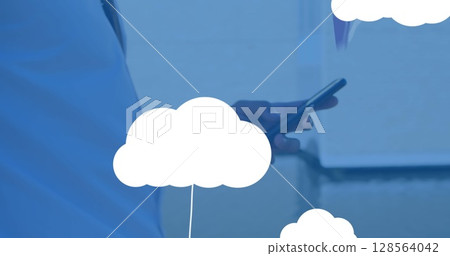 Image of digital clouds with icons over man using smartphone Image of digital clouds with icons over man using smartphone 128564042