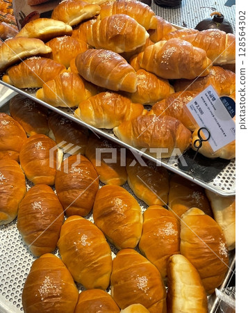Golden, flaky salt bread with a buttery aroma, paired with bold black coffee for a perfect balance of savory and bitter flavors. A simple yet satisfying combination for breakfast or a coffee break! Golden, flaky salt bread with a buttery aroma, paired with bold black coffee for a perfect balance of savory and bitter flavors. A simple yet satisfying combination for breakfast or a coffee break! 128564302