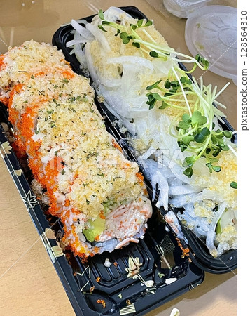 Assorted sushi set, featuring a variety of traditional Japanese dishes. Perfect for a delightful and authentic Japanese dining experience. 128564310