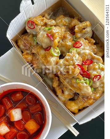 Delicious kimbap rolls filled with fresh vegetables, seasoned rice, and savory proteins, all wrapped in crisp seaweed. A perfect combination of flavor and texture in every bite. 128564311