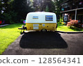 Vintage Boler Camper Trailer Parked in Driveway at Sunset 128564341