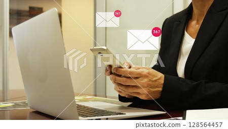Image of icons and numbers over woman using smartphone and laptop 128564457