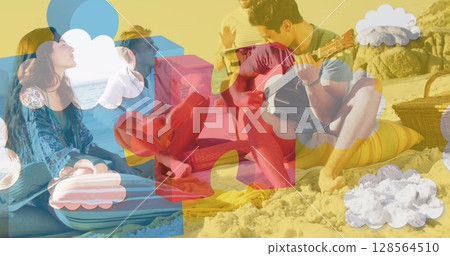 Image of colourful puzzle pieces over happy friends at summer beach party 128564510