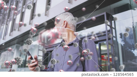 Image of covid 19 cells over senior man wearing face mask Image of covid 19 cells over senior man wearing face mask 128564565