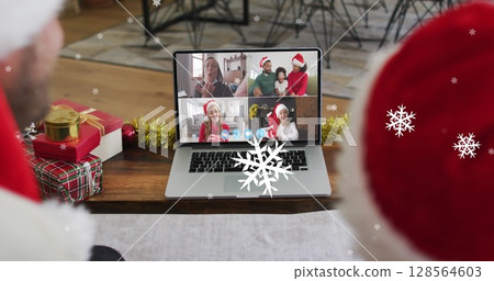 Image of snow over smiling caucasian father and son in santa hats on christmas laptop image call Image of snow over smiling caucasian father and son in santa hats on christmas laptop image call 128564603