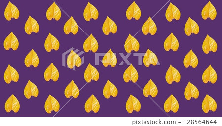 Image of multiple orange autumn leaves over purple background 128564644