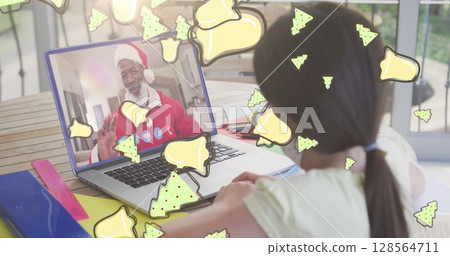 Image of christmas cookies over caucasian girl with face mask on laptop image call with family Image of christmas cookies over caucasian girl with face mask on laptop image call with family 128564711