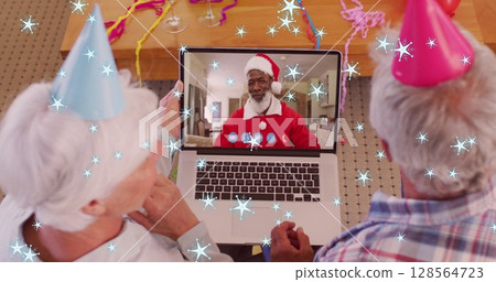 Image of snow falling text over senior caucasian couple on laptop image call with family 128564723