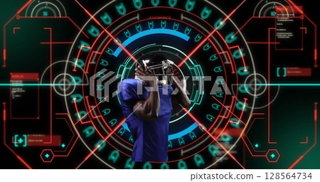 Image of african american male rugby player over scope scanning on black background 128564734