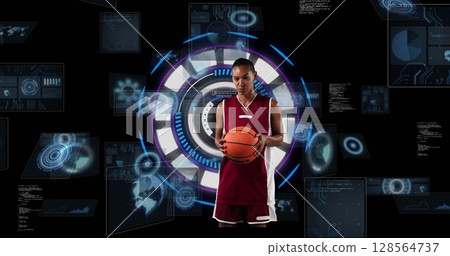 Image of african american female basketball player over scope scanning on black background 128564737