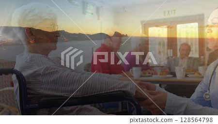 Image of caucasian senior women and man and female medic over seascape 128564798