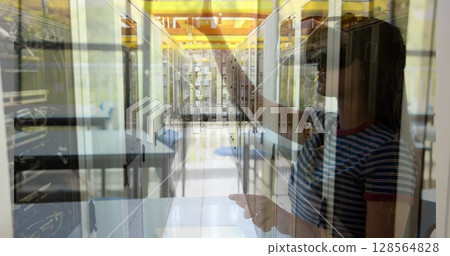Image of computer server over schoolgirl wearing vr headsets 128564828