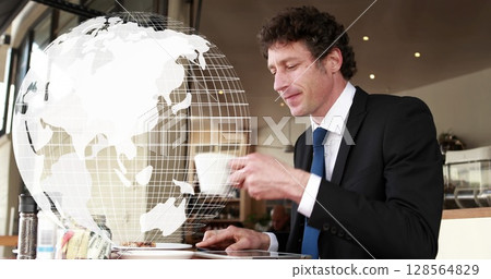 Image of globe with network of connections over businessman using smartphone 128564829