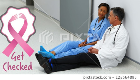 Image of breast cancer awareness text over diverse doctors at hospital Image of breast cancer awareness text over diverse doctors at hospital 128564893