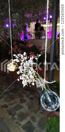 Rustic floral arrangement in jars. 128565009