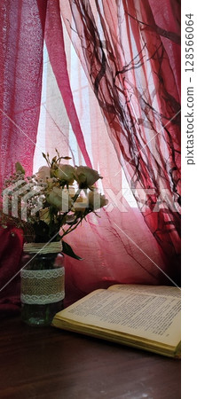 Still life of roses in vintage mason jar. Still life with book, coffee, and flowers. Still life of roses in vintage mason jar. Still life with book, coffee, and flowers. 128566064