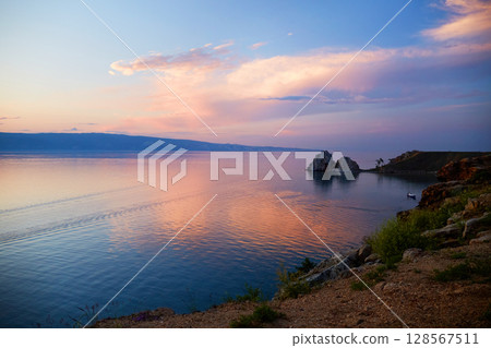 Lake Baikal on a summer evening. Khuzhir Bay, Shamanka Rock Lake Baikal on a summer evening. Khuzhir Bay, Shamanka Rock 128567511