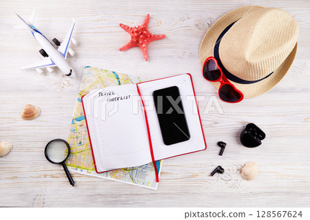 Travel checklist concept. Map, phone, notebook for to do list Travel checklist concept. Map, phone, notebook for to do list 128567624