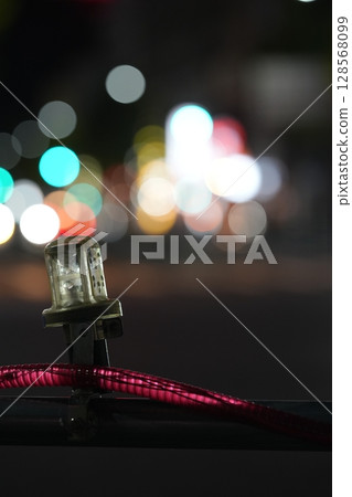 The lights of the city visible beyond the emergency lights 128568099