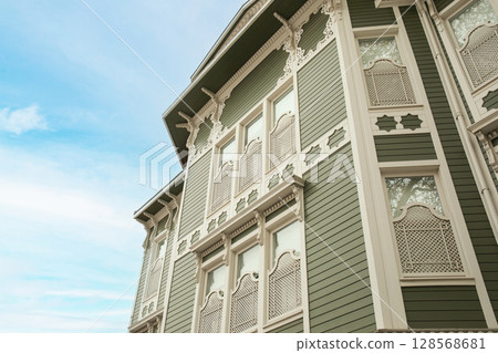 Historic building showcases detailed woodwork and a clear sky Historic building showcases detailed woodwork and a clear sky 128568681