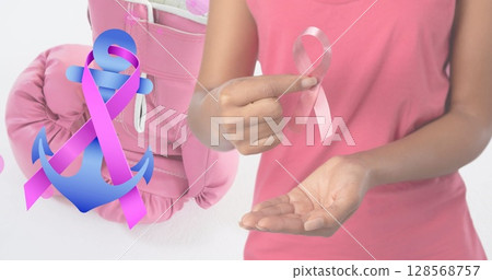 Image of breast cancer awareness text over caucasian woman and boxing gloves Image of breast cancer awareness text over caucasian woman and boxing gloves 128568757