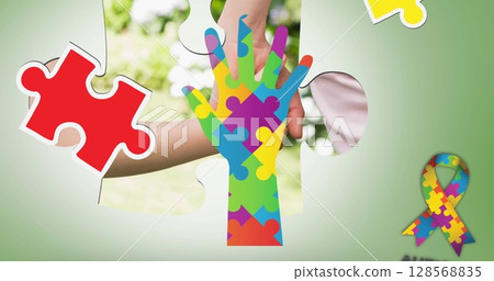Image of colourful puzzle pieces hand over mother and child 128568835