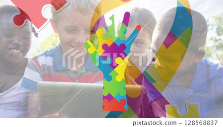 Image of colourful puzzle pieces ribbon and hand over children Image of colourful puzzle pieces ribbon and hand over children 128568837