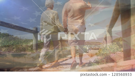 Image of senior caucasian couple holding hands on beach over flag of united states of america Image of senior caucasian couple holding hands on beach over flag of united states of america 128568933