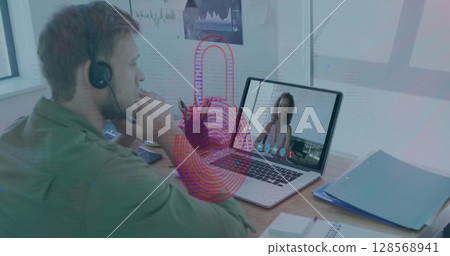Image of biometric fingerprint over caucasian man using phone headset and laptop Image of biometric fingerprint over caucasian man using phone headset and laptop 128568941