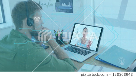 Image of online icons over caucasian man using phone headset and laptop 128568948