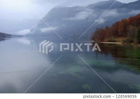 Evening autumn landscape and lake Bohinj in Slovenia, selective focus 128569056
