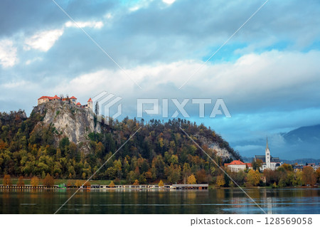 Autumn landscape with lake Bled in Slovenia. Santa Maria church in island Autumn landscape with lake Bled in Slovenia. Santa Maria church in island 128569058