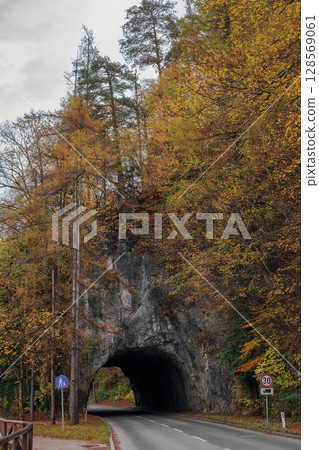 Tunnel through rocky mountain. Road through mount Tunnel through rocky mountain. Road through mount 128569061