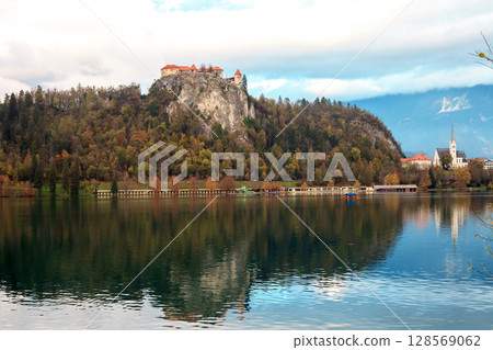 Autumn landscape with lake Bled in Slovenia. St Mary's church in island 128569062