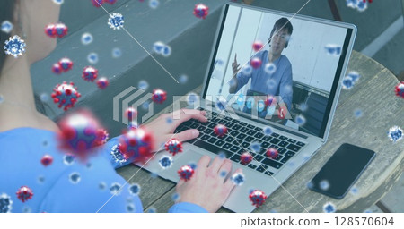 Image of covid 19 cells over businessman on laptop image call 128570604