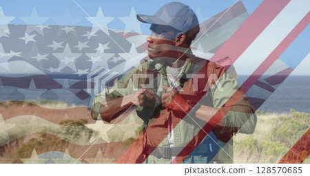 Image of american flag over african american man hiking in mountains Image of american flag over african american man hiking in mountains 128570685