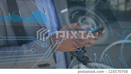 Image of scope scanning and computer circuit board over businessman using smartphone 128570708