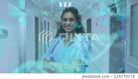 Image of medical data processing over smiling biracial female doctor Image of medical data processing over smiling biracial female doctor 128570718