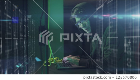 Image of data processing over asian male hacker in hoodie with laptop by computer servers 128570806